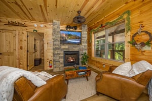Living room with stone fireplace