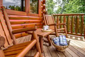 Rocking chairs on the deck at Eagles Sunrise, a 2 bedroom cabin rental located in Pigeon Forge