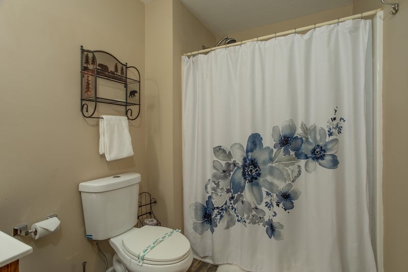 Bathroom with a tub and shower at Peace at the River, a 3 bedroom cabin rental located in Pigeon Forge