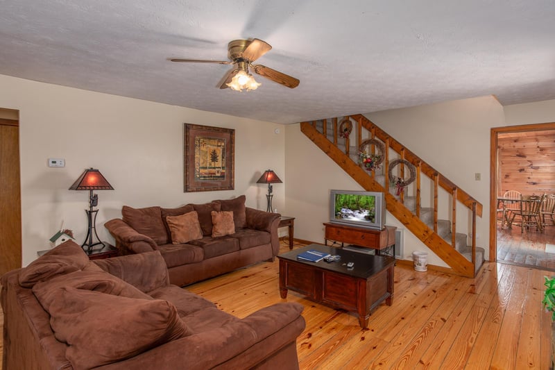 Living room with a sofa and loveseat at Black Bear Ridge, a 3bedroom cabin rental located in Pigeon Forge