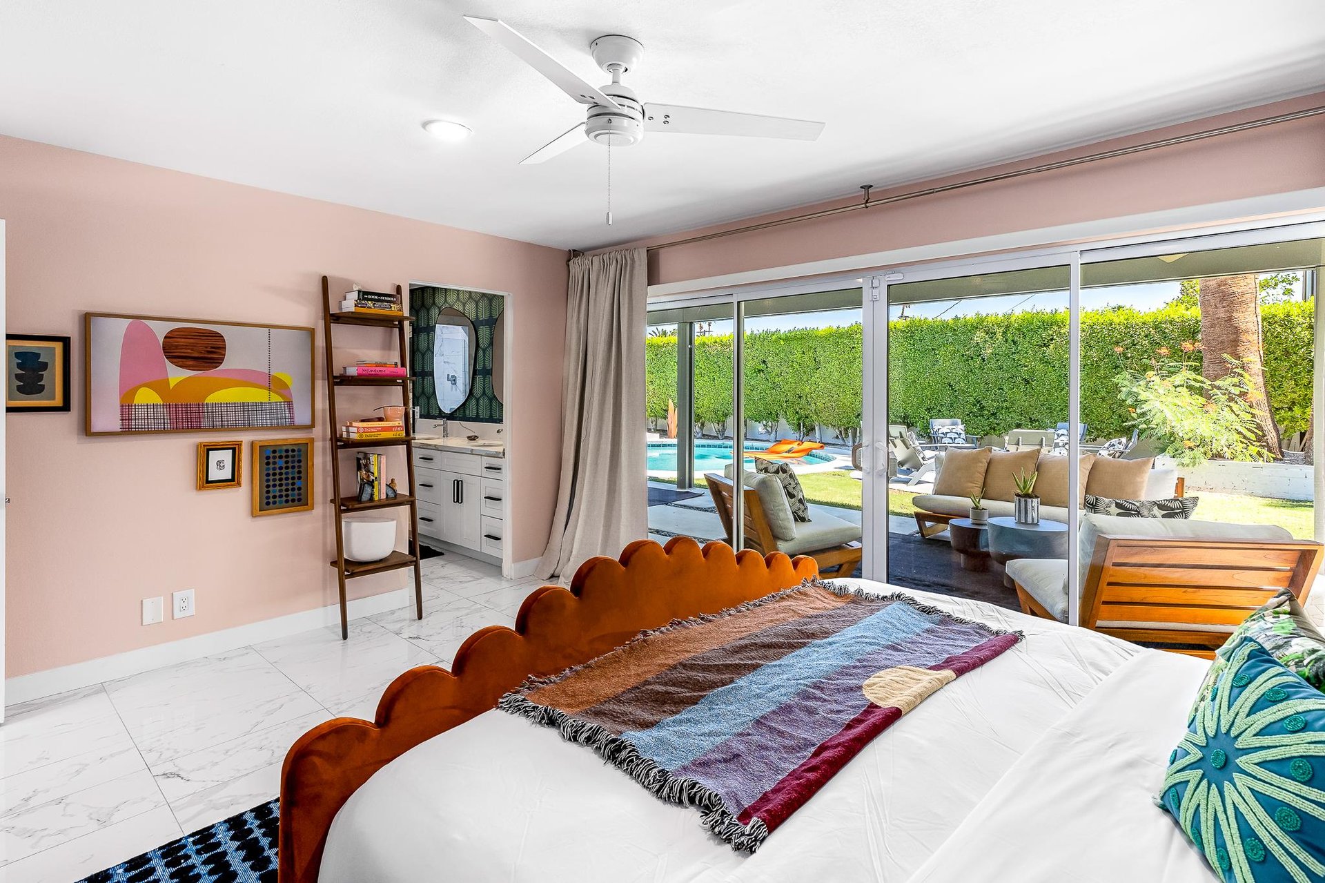 Primary bedroom has direct access to the pool area