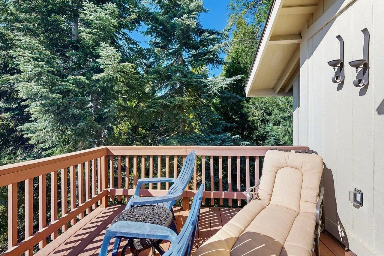 Beautiful, expansive deck with mountain  treetop views, outdoor dining, and BBQ.
