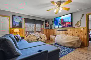 Sink into plush bean bags for your favorite movies on the big screen in this cozy entertainment room.