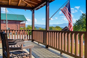 Step onto your private covered deck and soak in sweeping mountain vistas under clear blue skies. Two relaxing chairs invite you to unwind and breathe in the peaceful mountain air.