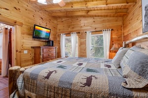 King bed beside windows