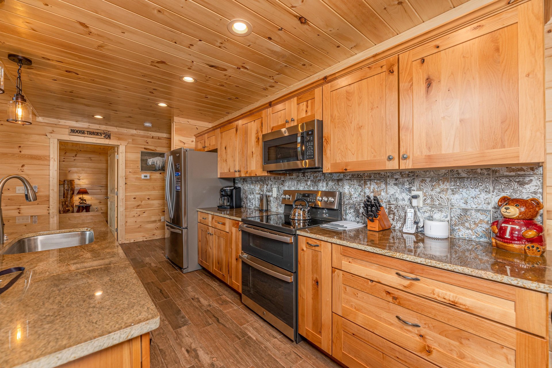 Full kitchen with natural wood cabinets