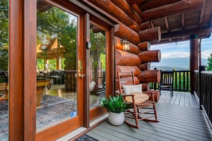 Step onto your private deck and settle into the rocking chair, where sweeping mountain vistas invite you to unwind and soak in the peaceful surroundings.