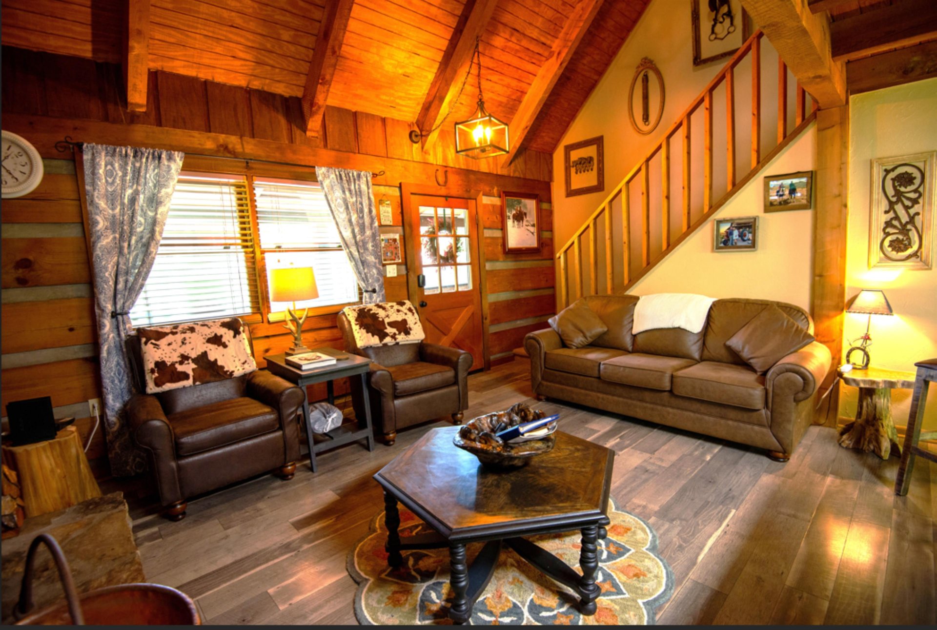 Sink into leather seating beneath exposed beams while warm lamplight creates the perfect atmosphere for your mountain retreat evenings.