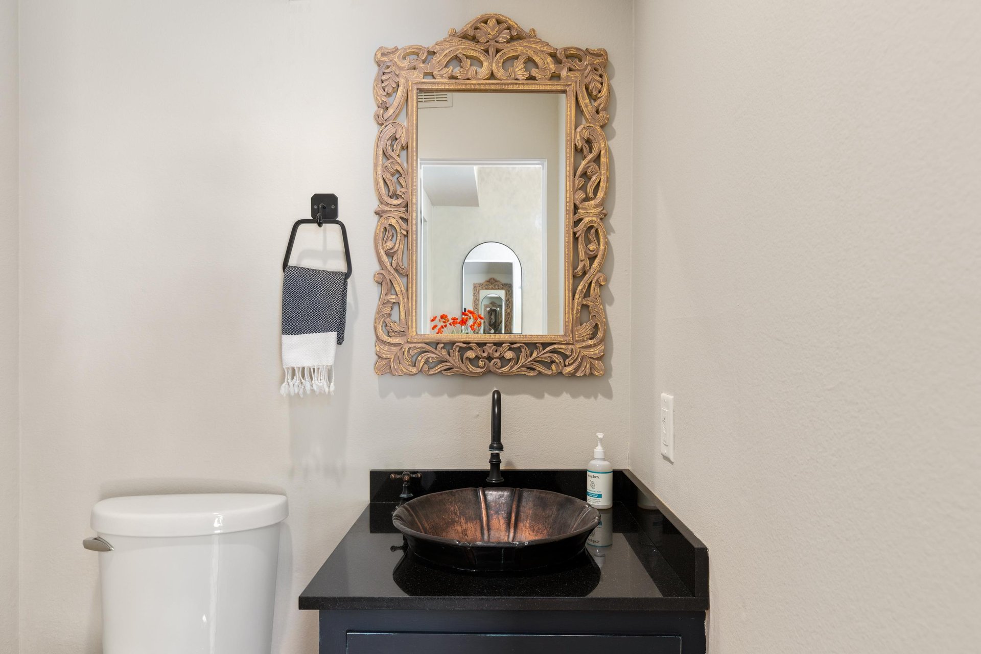 Half bathroom located near entryway.