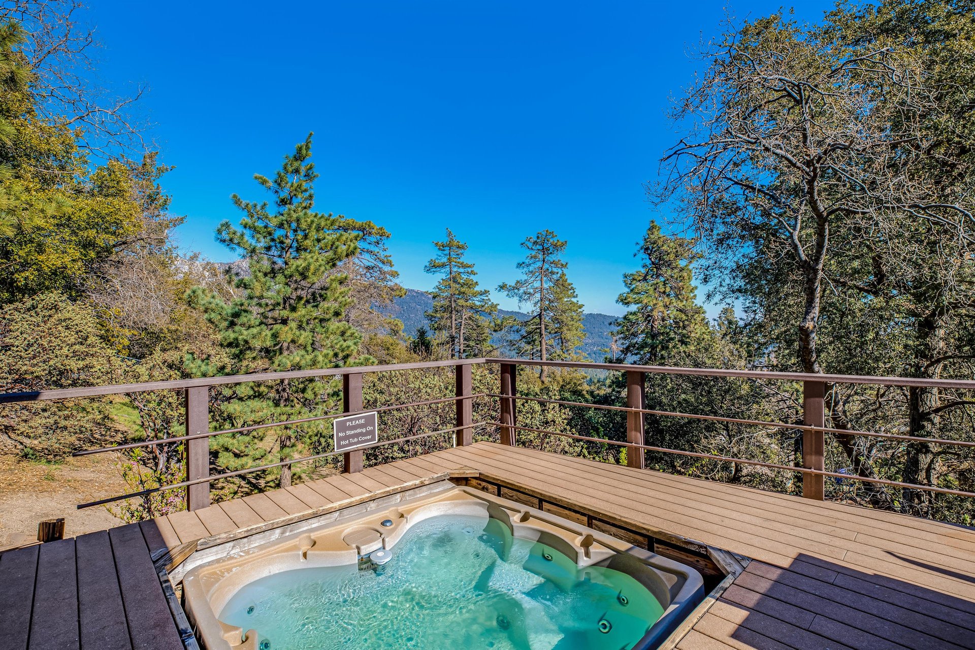 Hot tub with stunning mountain views.