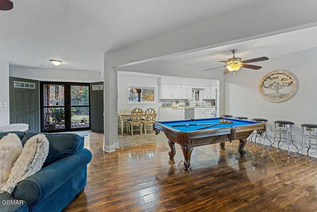 Gather with friends in this inviting openconcept space, where your game room flows seamlessly into the kitchen for easy entertaining.