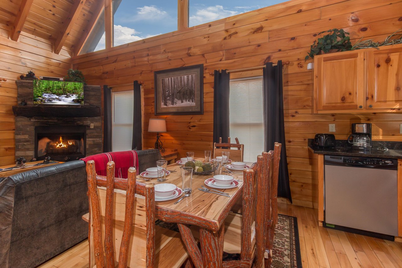 Dining room with seating for six at Country Bears Getaway, a 3bedroom cabin rental located in Gatlinburg