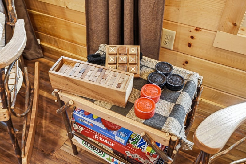 Cozy game collection awaits your evenings  wooden puzzles, classic board games, and checkers promise hours of rustic fun.