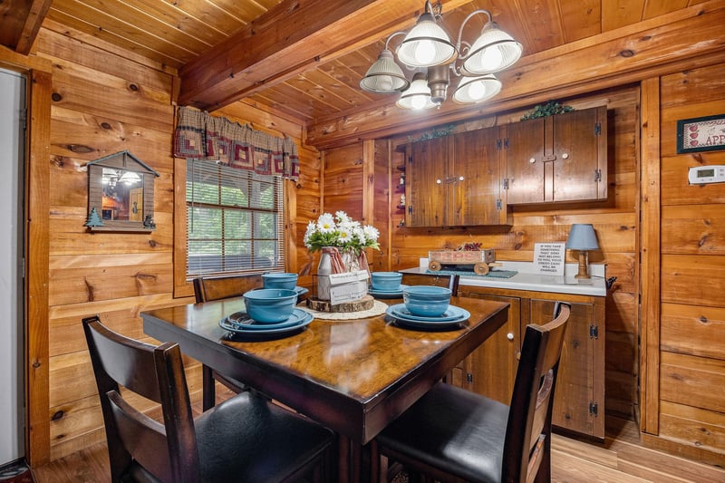 Dining table for four at Beary Good Time, a 1bedroom cabin rental located in Pigeon Forge