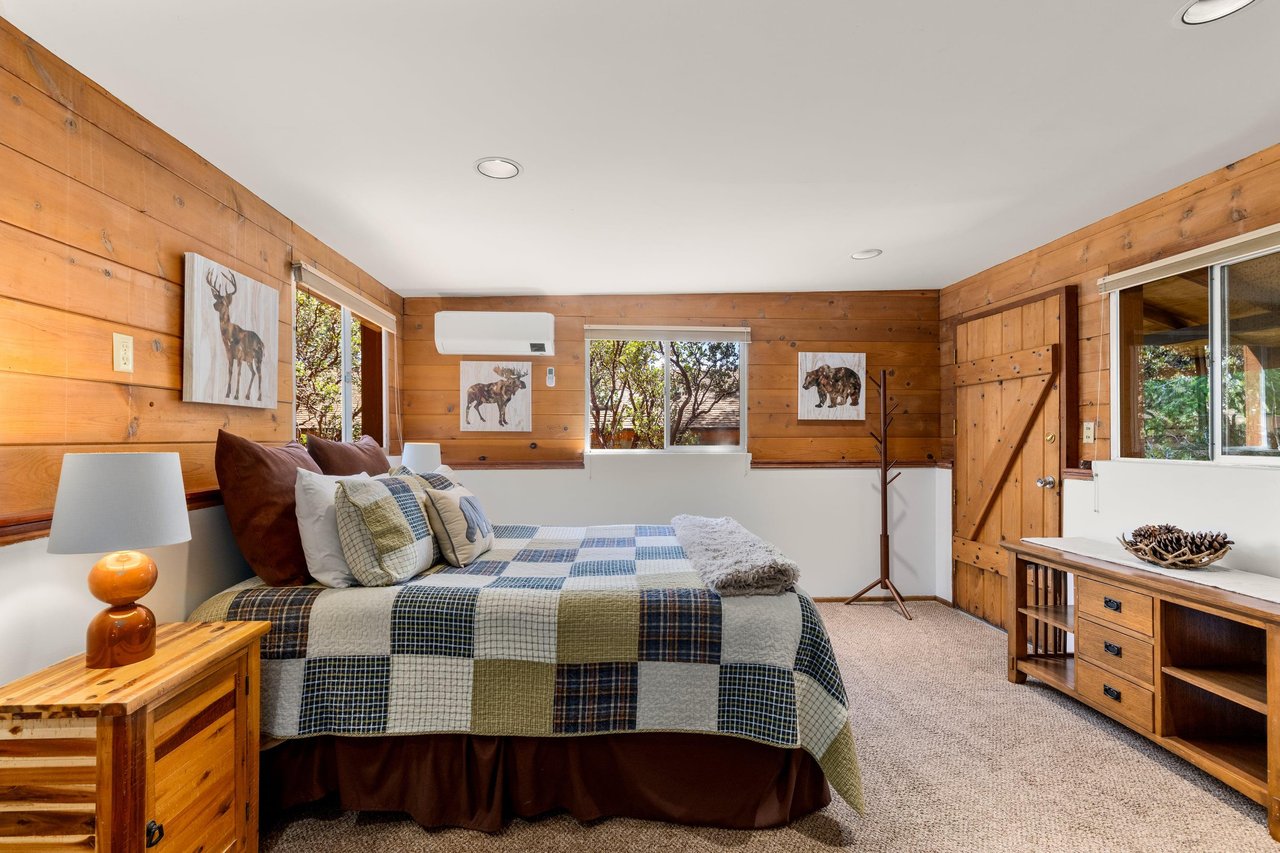 Downstairs bedroom with queen bed, remote controlled minisplit, and private entrance.