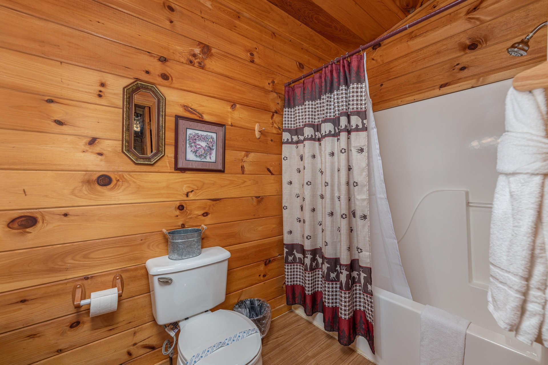 Bathroom with a tub and shower at A Cheerful Heart, a 2 bedroom cabin rental located in Pigeon Forge