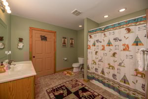 Bathroom with a tub and shower at Lazy Bear Retreat, a 4 bedroom cabin rental located in Pigeon Forge