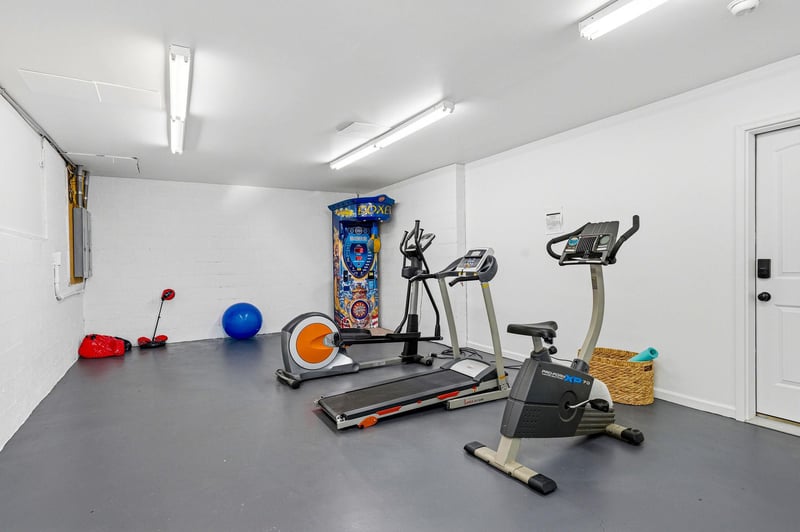 Keep up with your fitness routine in this private workout space, equipped with a treadmill, stationary bike, and fun arcade games to keep you motivated and entertained.