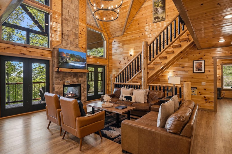 Sink into plush leather seating by your crackling stone fireplace, surrounded by soaring woodbeamed ceilings and forest views through floortoceiling windows.