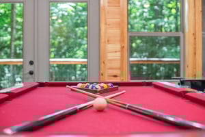 pool table, futon and arcade