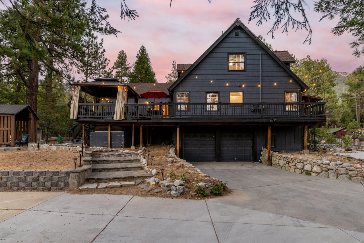 View of the wraparound deck and driveway.