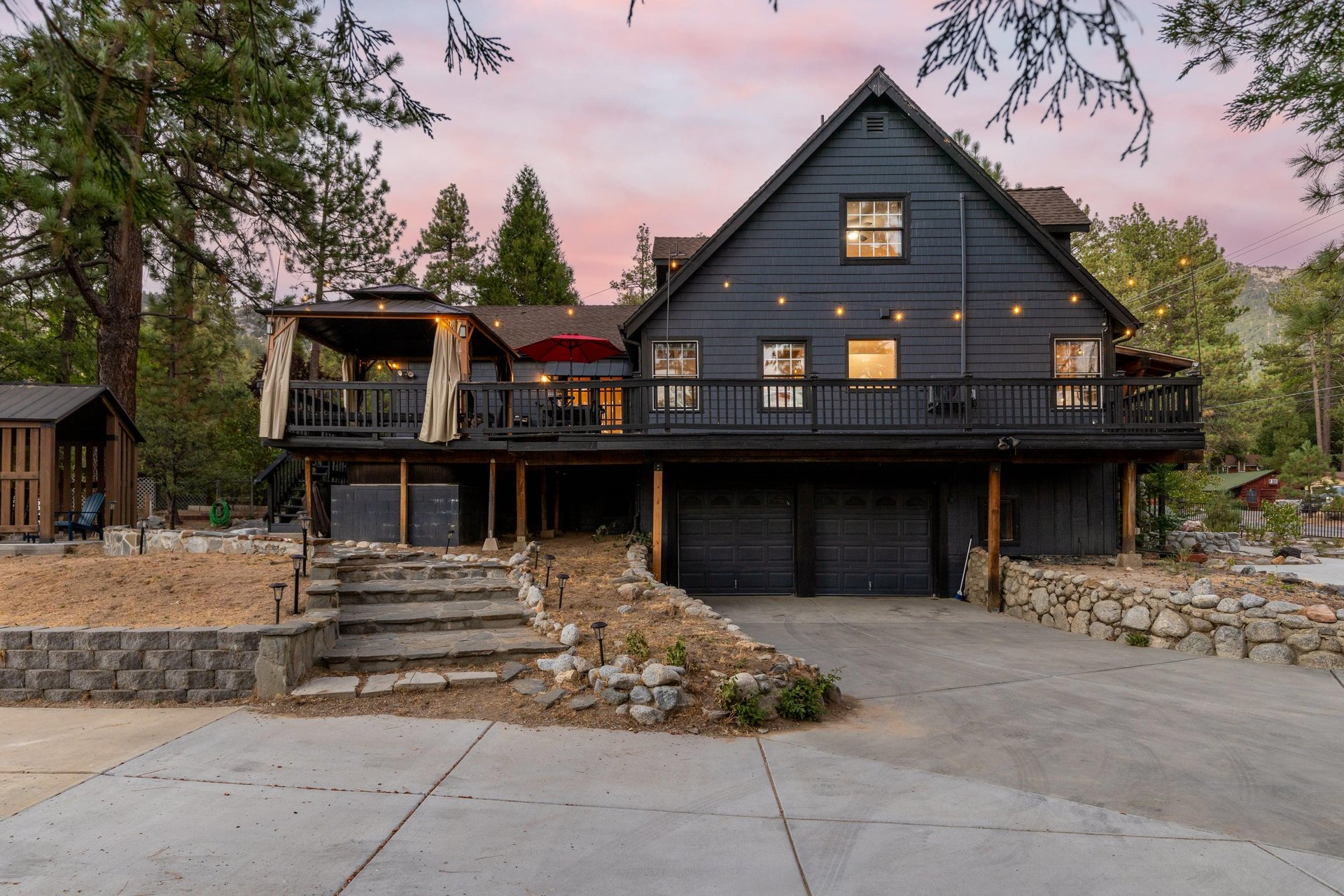 View of the wraparound deck and driveway.