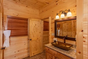 Single vanity sink beside door