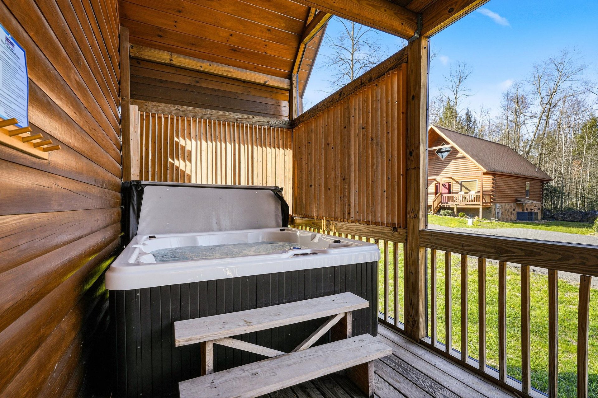 Soak your worries away in your private hot tub, nestled on your covered deck with peaceful wooded views.