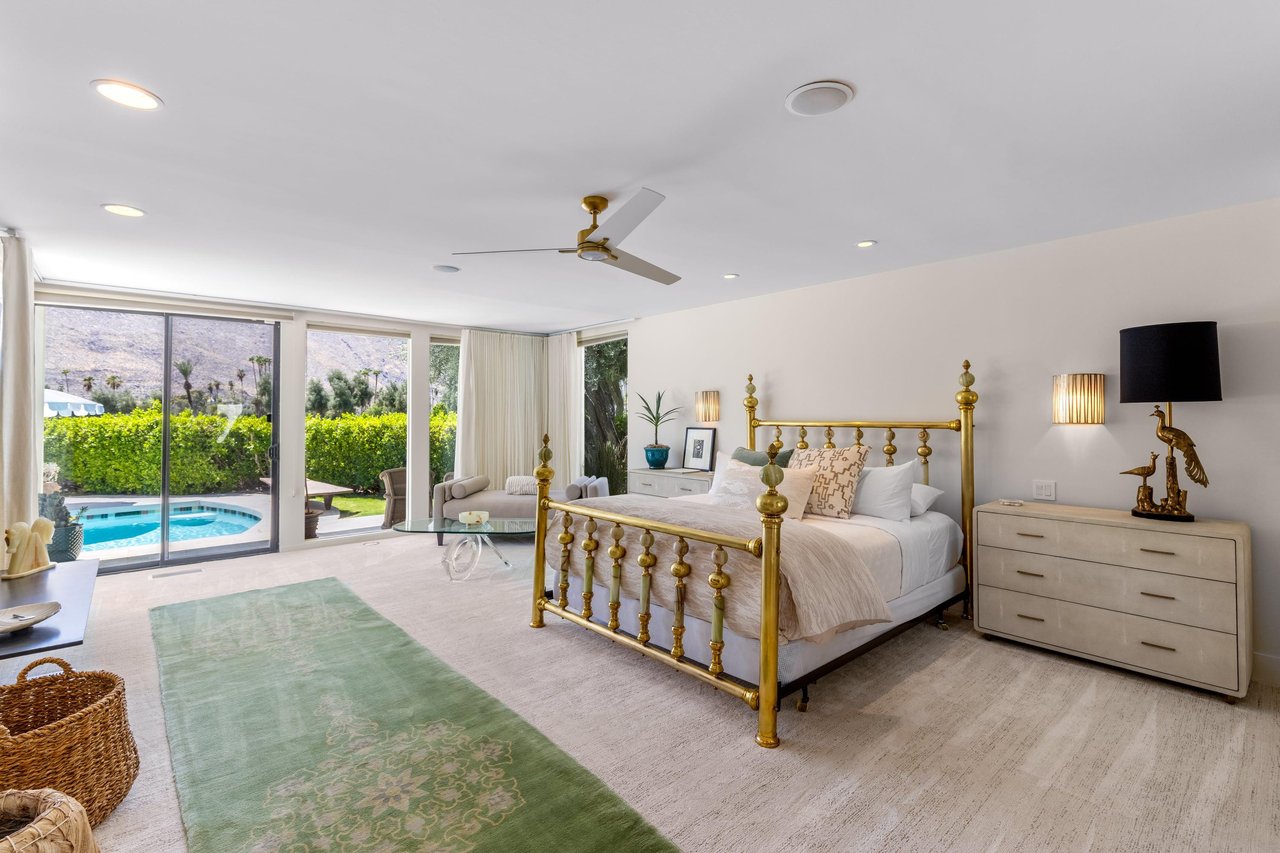 King size bed, gas fireplace, flatscreen TV, patio access, pool view, wet bar, and ensuite bathroom with outdoor shower.