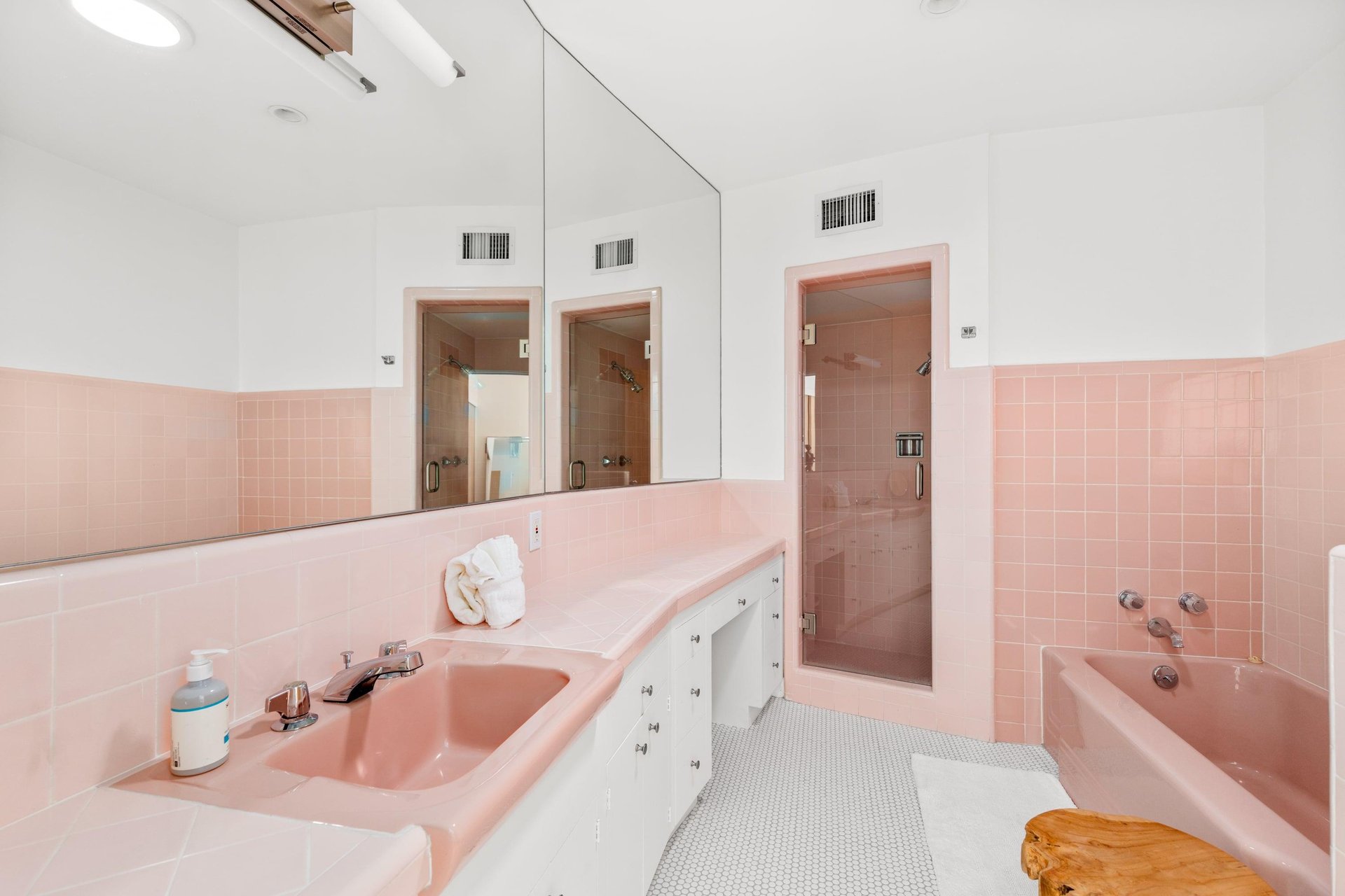 Ensuite bathroom with standalone shower, tub, and beautiful pink tile