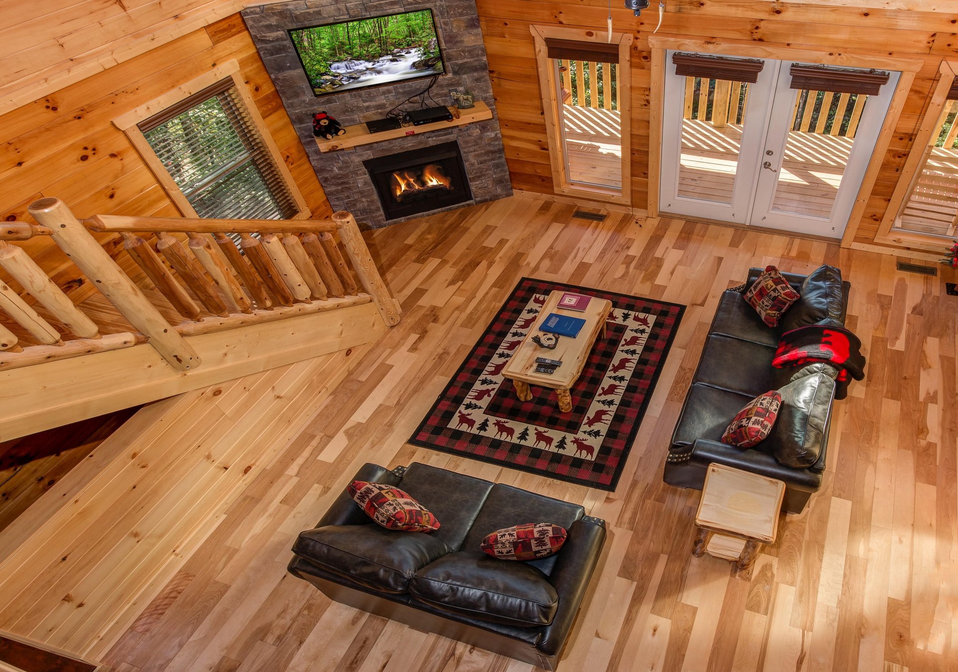 Looking down at the living room at Canyon Camp Falls, a 2 bedroom cabin rental located in Pigeon Forge