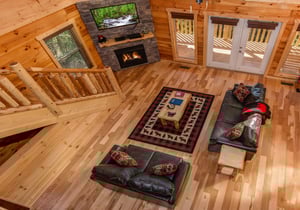 Looking down at the living room at Canyon Camp Falls, a 2 bedroom cabin rental located in Pigeon Forge