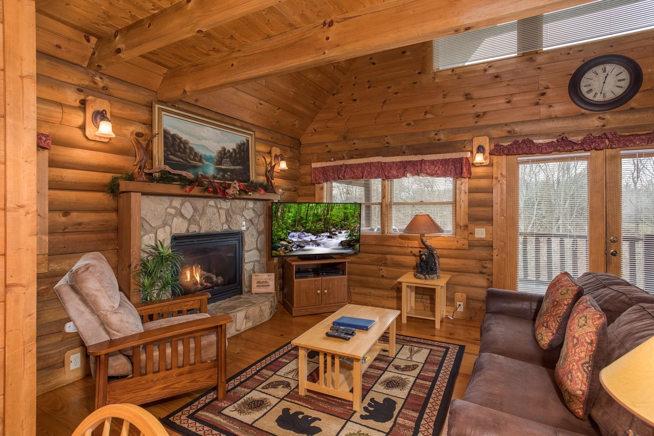 Living room with fireplace at Hanky Panky, a 1bedroom cabin rental located in Pigeon Forge