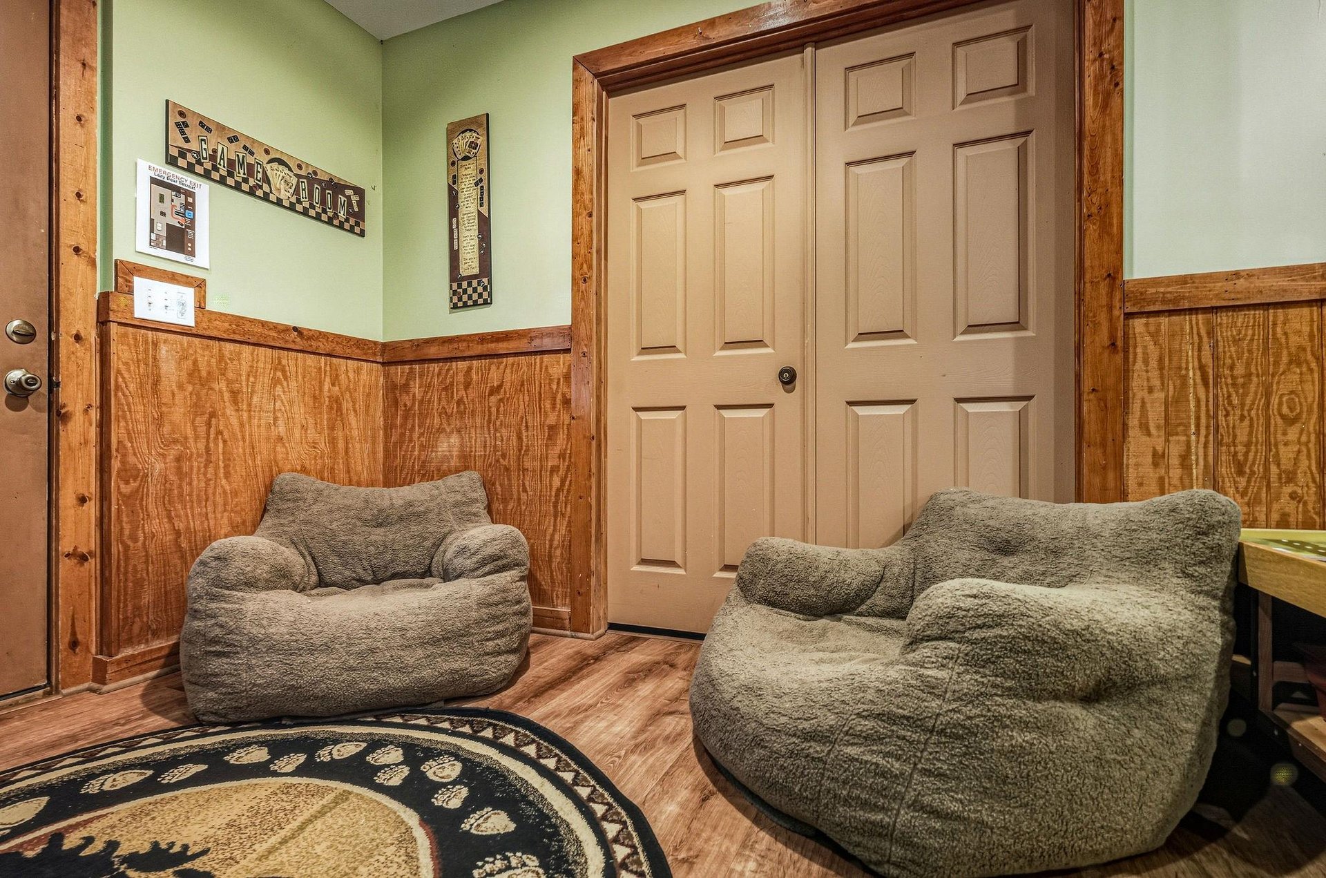 Sink into these plush bean bag chairs and unwind in your cozy rustic retreat with beautiful wood paneling.