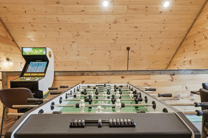 Challenge friends to foosball matches in your cozy woodpaneled game room, complete with arcade games for endless entertainment.