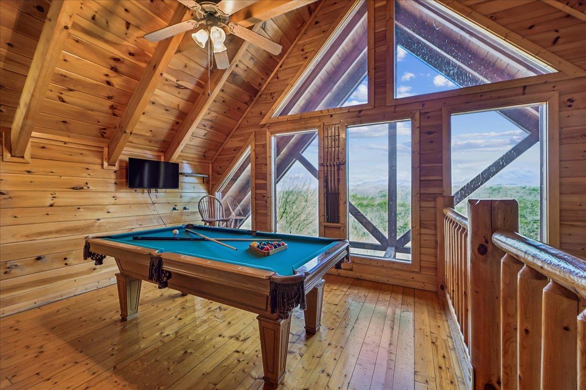 Game Room Pool table with a view and a multicade arcade game