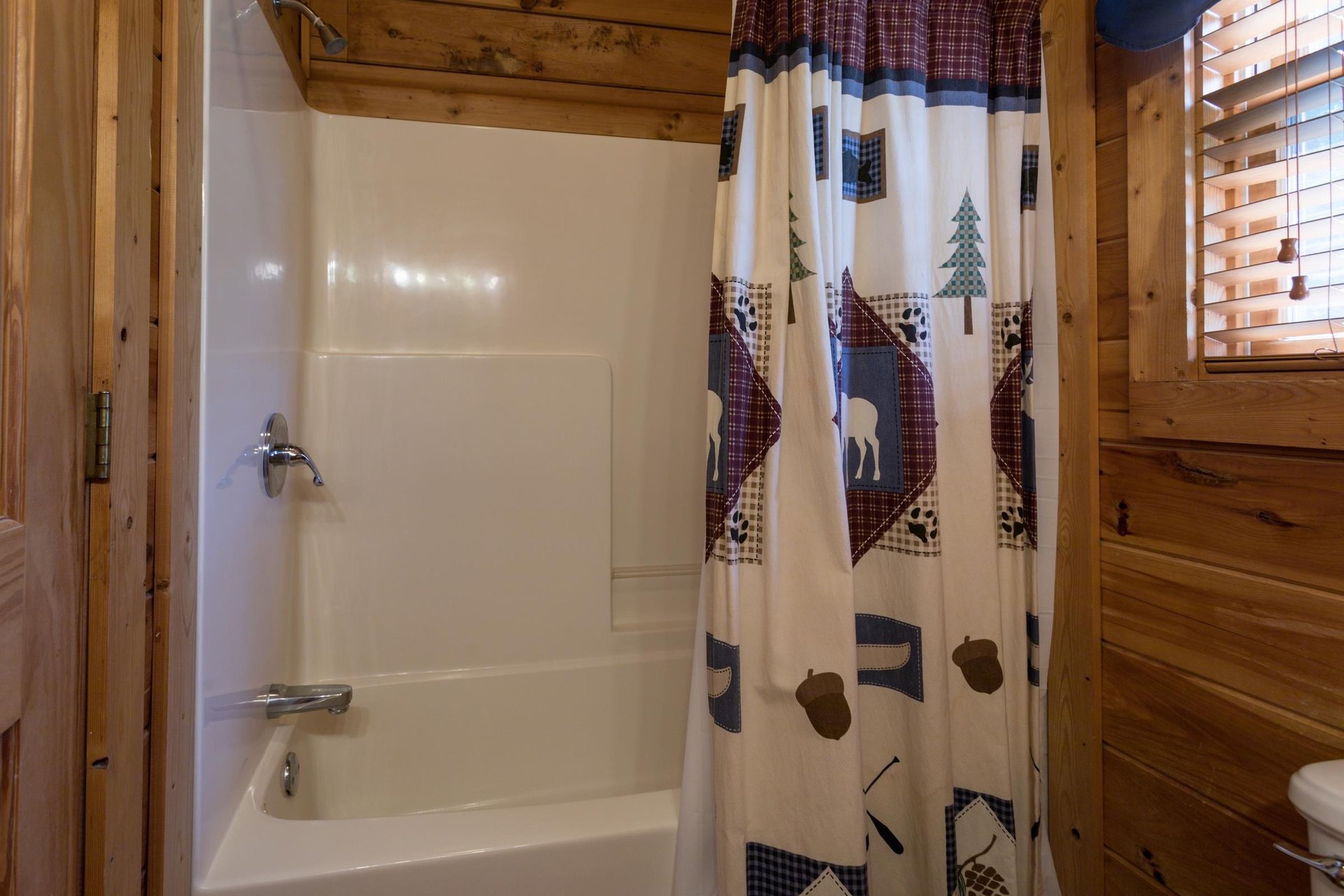 bathroom with tub and shower at angels majestic view a 3 bedroom cabin rental located in pigeon forge