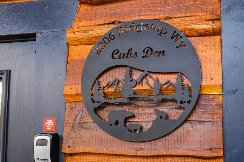 Welcome to Cubs Den, your mountain retreat at 2606 Ridgetop Way, where rustic charm meets modern comfort in this beautifully appointed cabin.