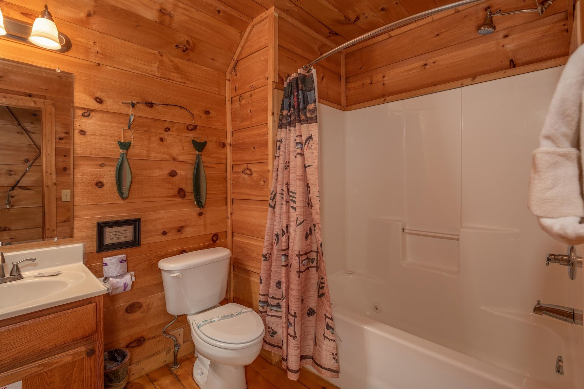Bathroom with a tub and shower at Logans Smoky Den, a 2 bedroom cabin rental located in Pigeon Forge