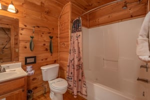 Bathroom with a tub and shower at Logans Smoky Den, a 2 bedroom cabin rental located in Pigeon Forge