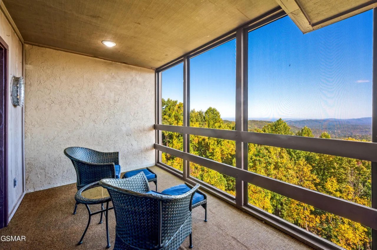 Relax on your private balcony with stunning forest views stretching to distant mountains. Enjoy morning coffee or evening unwinding in comfortable seating.
