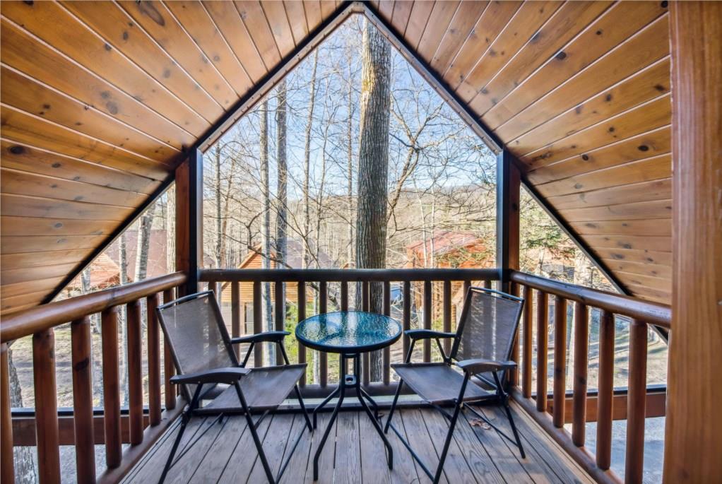 Step onto your private balcony with intimate seating for two, where forest views create the perfect backdrop for morning coffee or sunset relaxation.