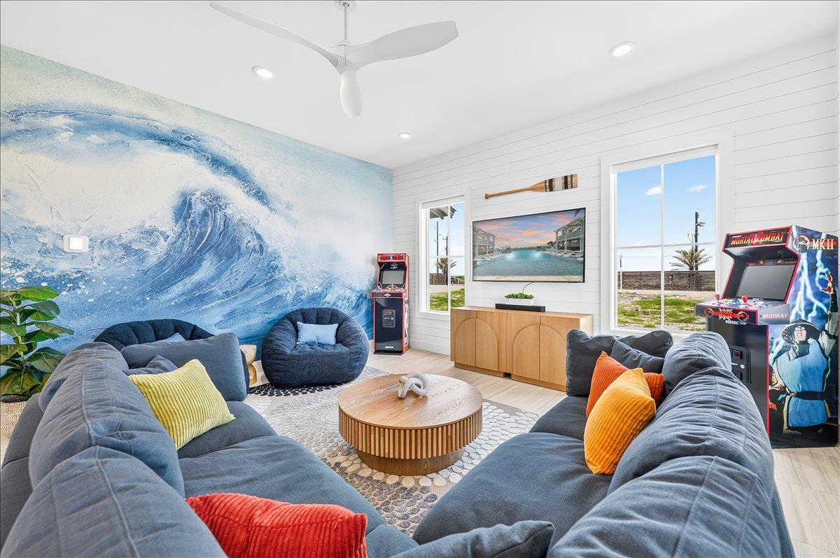 The firstfloor game lounge is designed with all ages in mind, featuring a convenient wet bar and a welcoming atmosphere where young adults, teens, and children can gather for games, fun, and quality 