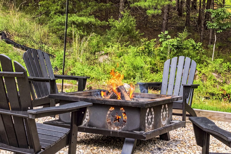 Gather around the crackling fire under the open sky, where Adirondack chairs invite you to unwind and soak in the peaceful forest surroundings.