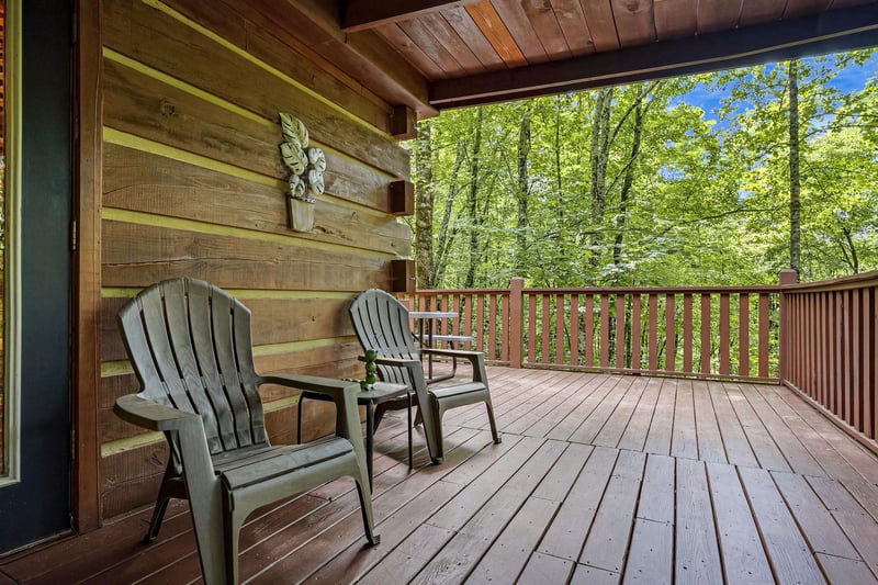 Picture yourself on this private deck, surrounded by lush forest, sipping morning coffee in these cozy Adirondack chairs. The peaceful seclusion invites you to breathe deeply and relax.