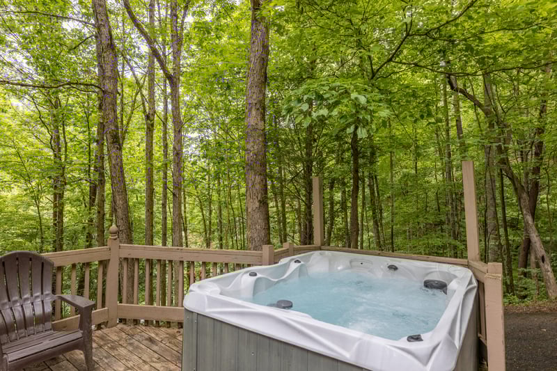 Trees surrounding the hot tub at Heavenly Hideaway, a 2bedroom cabin rental located in Gatlinburg