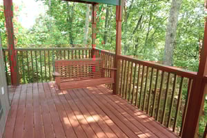 Swing on the deck at Bushwood Lodge, a 3bedroom cabin rental located in Gatlinburg