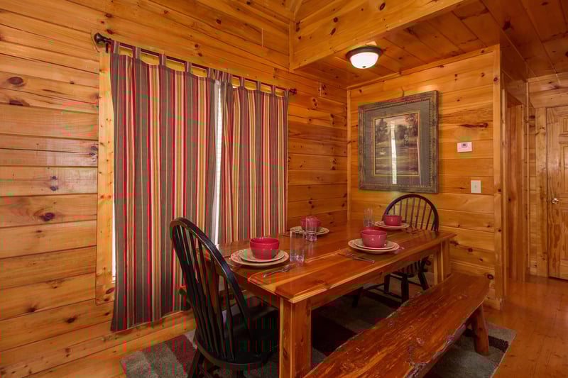 Dining table for six at A Beautiful Memory, a 4 bedroom cabin rental located in Pigeon Forge