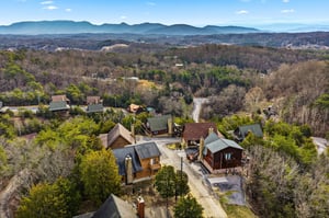 Scenic mountain property nestled among rolling hills and wooded landscape, offering peaceful retreat setting.