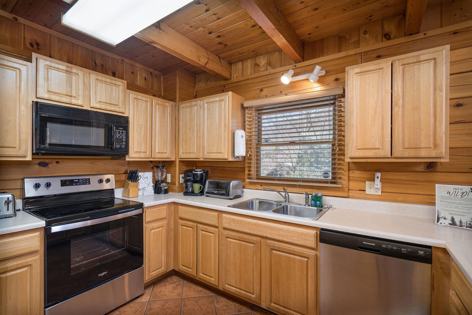 kitchen cabinets and sink with window